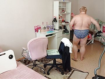 Mother-in-law vacuums the room naked