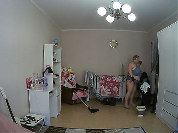 mother-in-law cleans the room naked